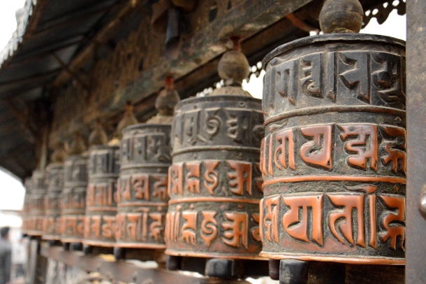 2 Swayambhu prayer wheels close up