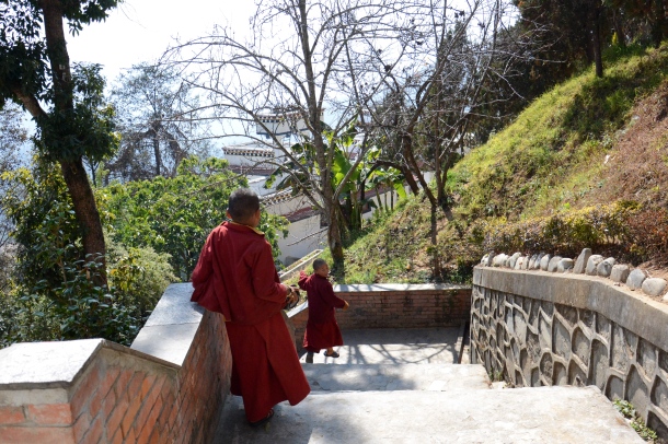 3 Namo Buddha children monks playing on stairs